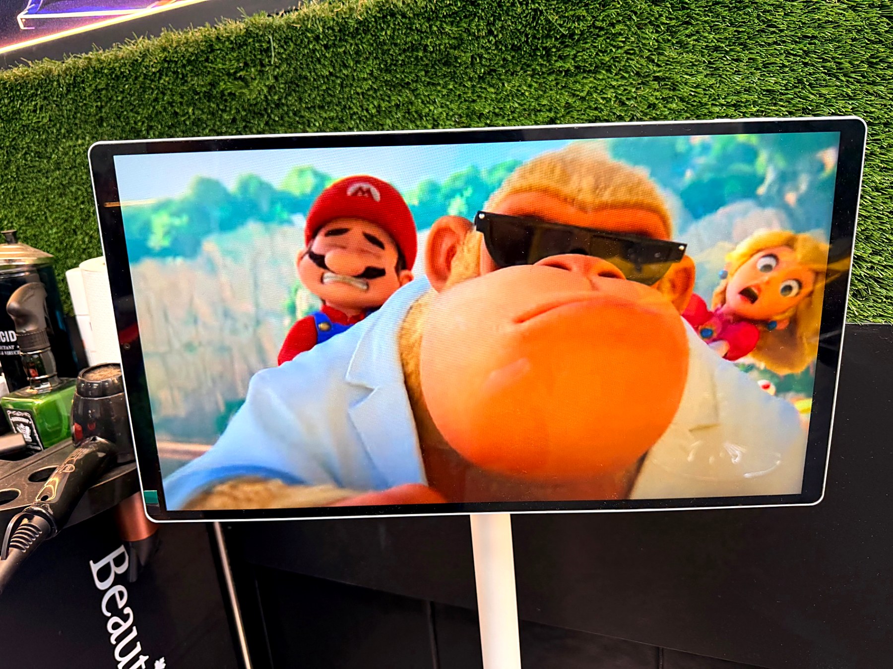 Kids screen showing Mario characters at the barbershop