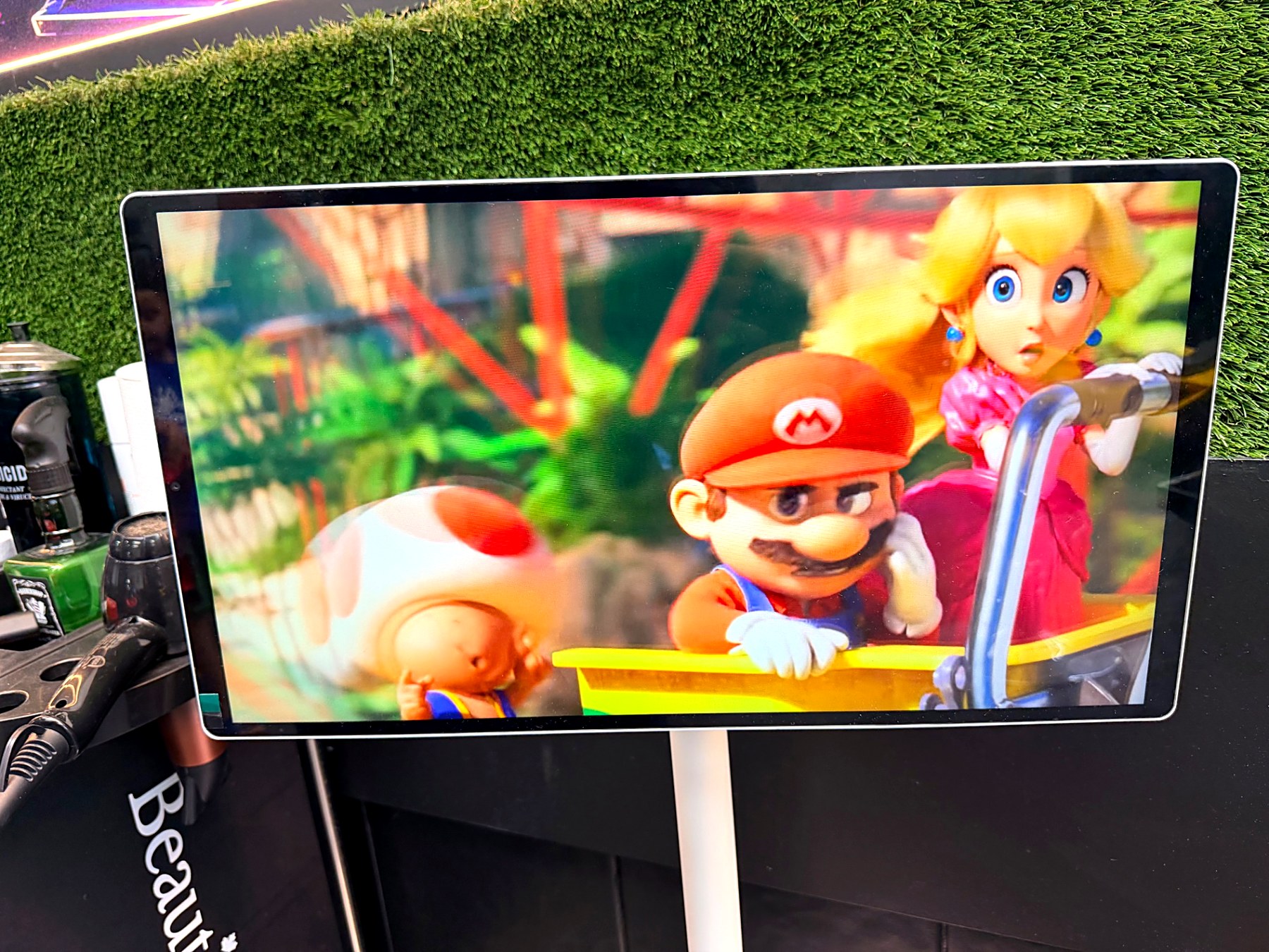 Kids screen with Mario and Princess Peach at International Cuts